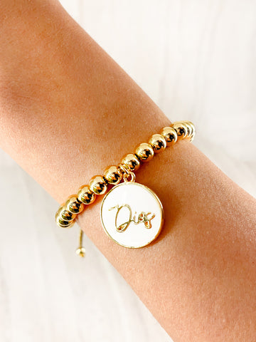Pulsera con Dije Blanco de Dios - Balines Dorados